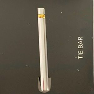 Tie clip ,worn to enhance the look of your thigh silver with a brass accent